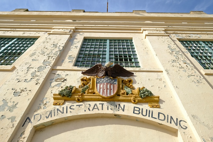(Eric Risberg | AP) In this photo taken Tuesday, Nov. 12, 2019, the word "Free" is painted below an eagle figure that hangs on the entryway to the main cell house on Alcatraz Island in San Francisco. The words were added during the Native American occupation of the island. The week of Nov. 18, 2019, marks 50 years since the beginning of a months-long Native American occupation at Alcatraz Island in the San Francisco Bay. The demonstration by dozens of tribal members had lasting effects for tribes, raising awareness of life on and off reservations, galvanizing activists and spurring a shift in federal policy toward self-determination.