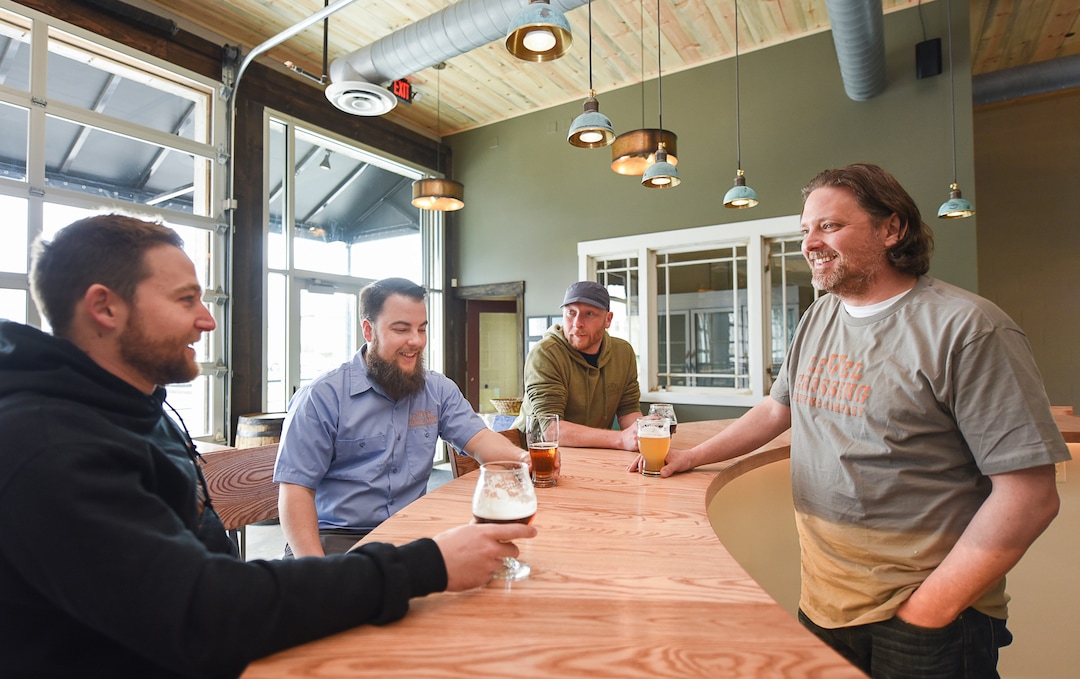 (Francisco Kjolseth  |  The Salt Lake Tribune) Level Crossing Brewing Co. owner Mark Medura, right, is joined by Eric Stonehill, Project Manager, Chris Detrick, head brewer and Andrew Madsen of Madcraft Sign and Fabrication Co., from left, as they get ready for a March 30 opening.