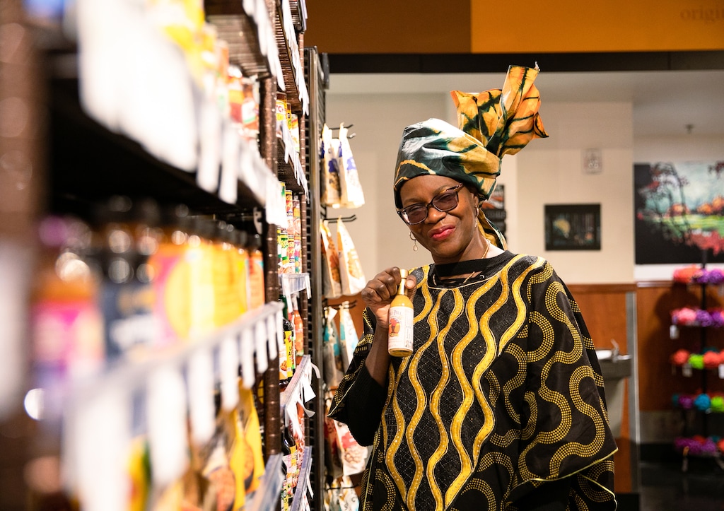 (Rachel Rydalch | The Salt Lake Tribune) Cathy Tshilombo-Lokemba, aka Mama Africa holding her Pili-Pili sauce at Harmons Emigration Market in Salt Lake City on Friday, Jan. 14, 2022.