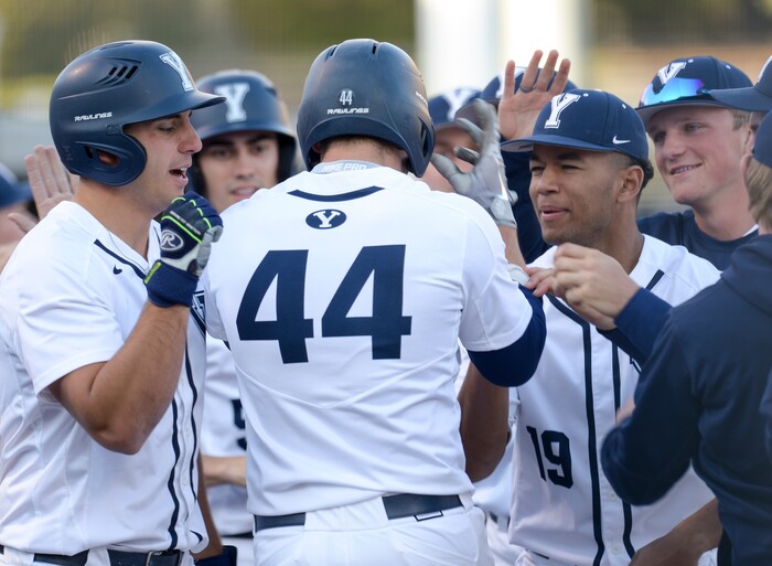 (Leah Hogsten  |  The Salt Lake Tribune) BYU's Brock Hale celebrates his scoring run in the 3rd inning to even the score 2-2 as Brigham Young University hosts University of Utah at Miller Park, Tuesday, April 24, 2018 in Provo.