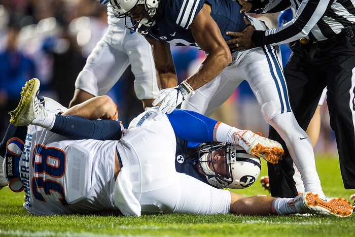 (Chris Detrick  |  The Salt Lake Tribune)  Boise State Broncos linebacker Leighton Vander Esch (38) tackles Brigham Young Cougars wide receiver Talon Shumway (21) during the game LaVell Edwards Stadium Friday, October 6, 2017. 
