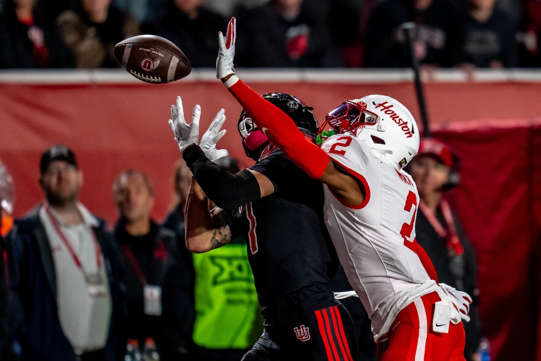 (Trent Nelson  |  The Salt Lake Tribune) Houston Cougars cornerback Jalen Mayo (2) interferes with Utah Utes wide receiver Braden Pegan (7) Utah hosts Houston, NCAA football at Rice-Eccles Stadium in Salt Lake City on Saturday, Oct. 24, 2026.