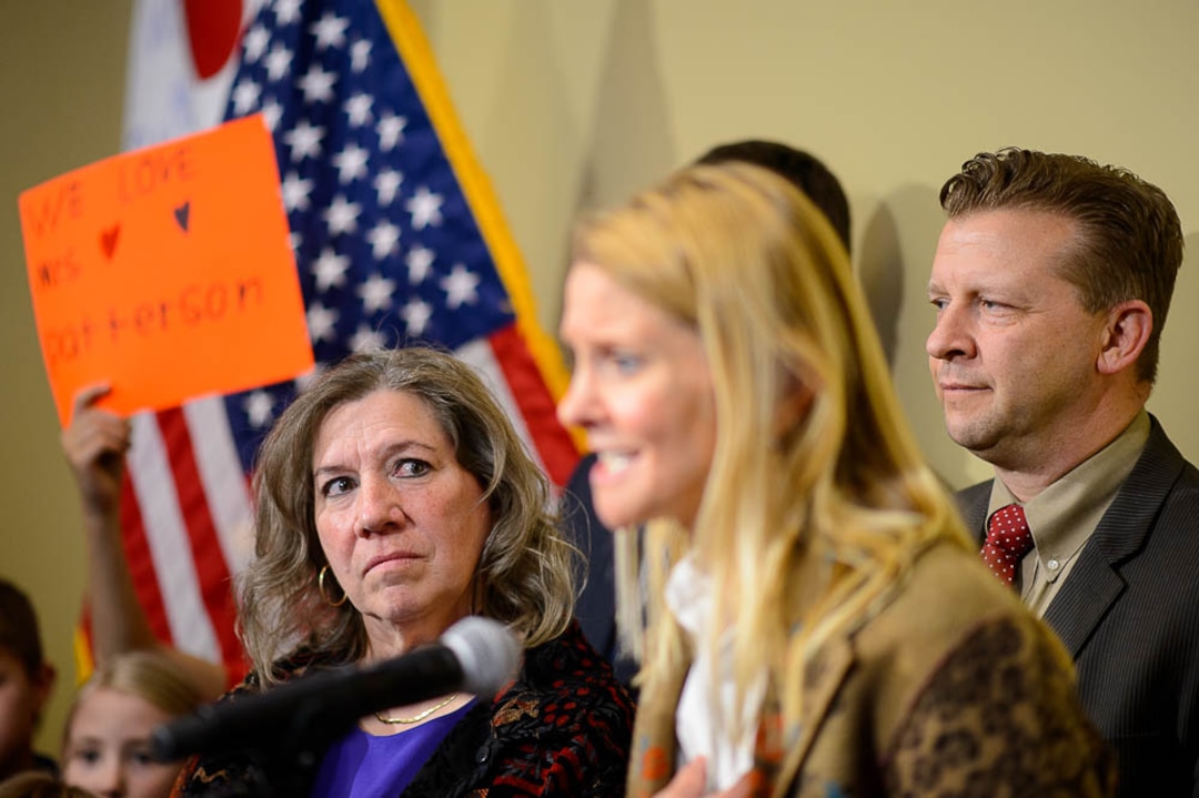 (Trent Nelson | The Salt Lake Tribune)  Valley View Elementary School teacher Moana Patterson listens as Tiffany Ivens-Spence speaks at a news conference by parents and students to show support for Patterson, in Salt Lake City on Monday March 11, 2019. Sen. Todd Weiler, R-Woods Cross, at right. Ivens-Spence is the parent of a student at the school.