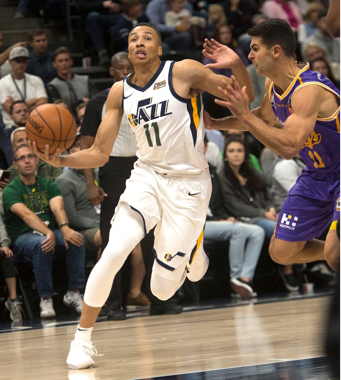 (Rick Egan  |  The Salt Lake Tribune) Utah Jazz guard Dante Exum (11)
takes the ball to the hoop, as Sydney Kings guard Kevin Lisch (11) defends, in preseason basketball  action, Utah Jazz vs. Sydney Kings, in Salt Lake City, Sunday, October 2, 2017.


