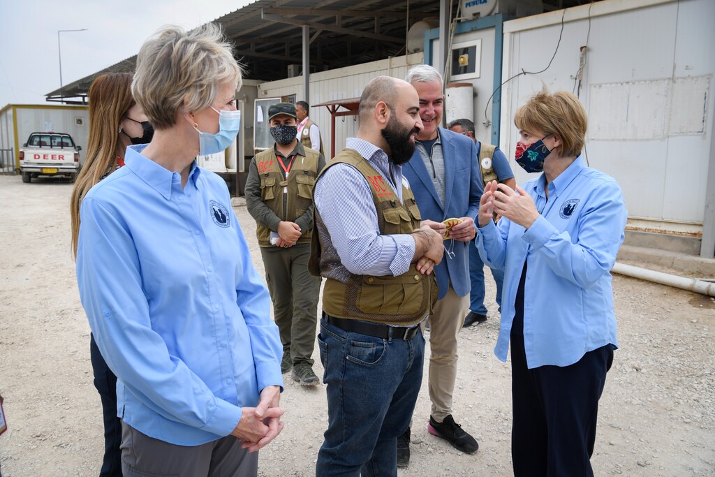 (The Church of Jesus Christ of Latter-day Saints)
Latter-day Saint Charities President Sharon Eubank, far right, speaks at Camp Sharya in Iraq with Karzan Noori, head of programs for Barzani Charity Foundation, as Relief Society President Jean B. Bingham, far left, looks on.