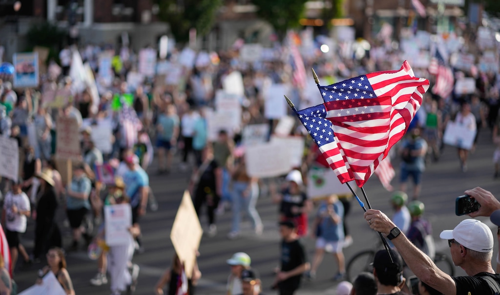 (Francisco Kjolseth  | The Salt Lake Tribune) An estimated 10,000 walk the streets of downtown Salt Lake City for a No Kings demonstration on Saturday, June 14, 2025.