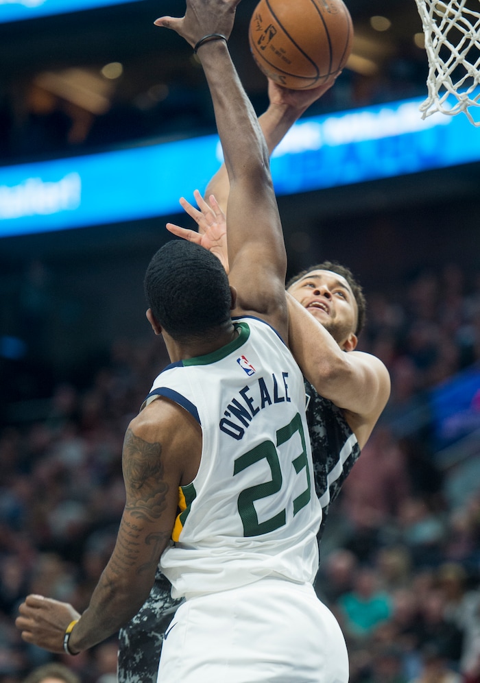 (Rick Egan  |  The Salt Lake Tribune)  San Antonio Spurs forward Kyle Anderson (1) shoots, as Utah Jazz forward Royce O'Neale (23)  defends, in NBA action Utah Jazz vs San Antonio Spurs in Salt Lake City, Monday, February 12, 2018.