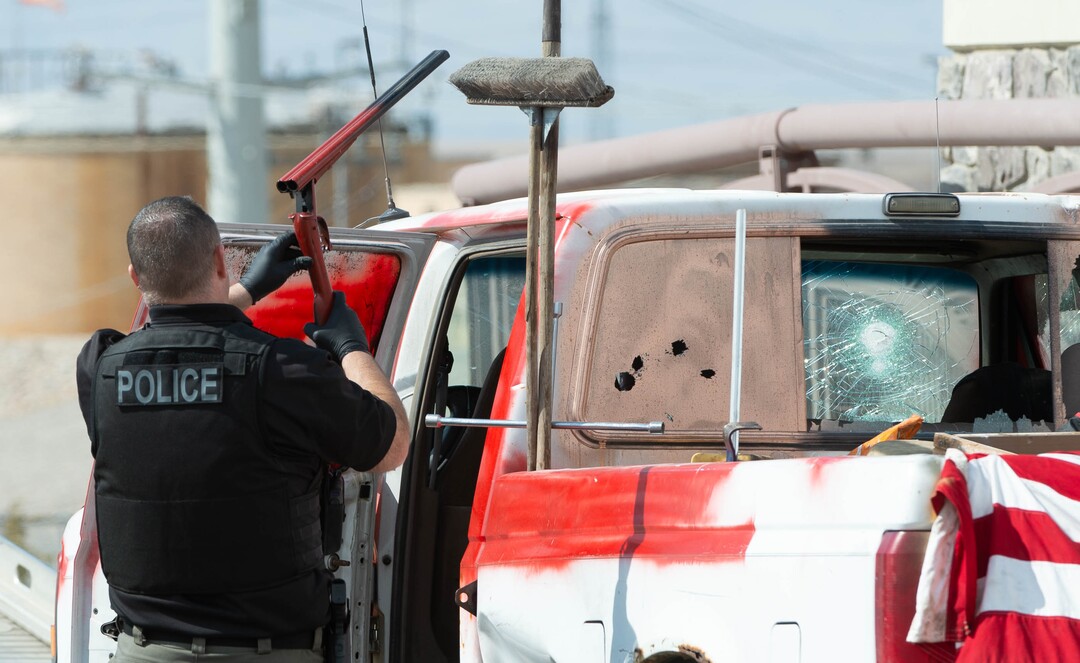 (Francisco Kjolseth  | The Salt Lake Tribune) Investigators remove a double barrel shotgun from a vehicle as numerous police agencies respond to a man driving erratically and claiming to have a gun and a bomb with an initial police chase ending on Center Street over Legacy Highway on Wednesday, March 17, 2021. The suspect was taken into custody.