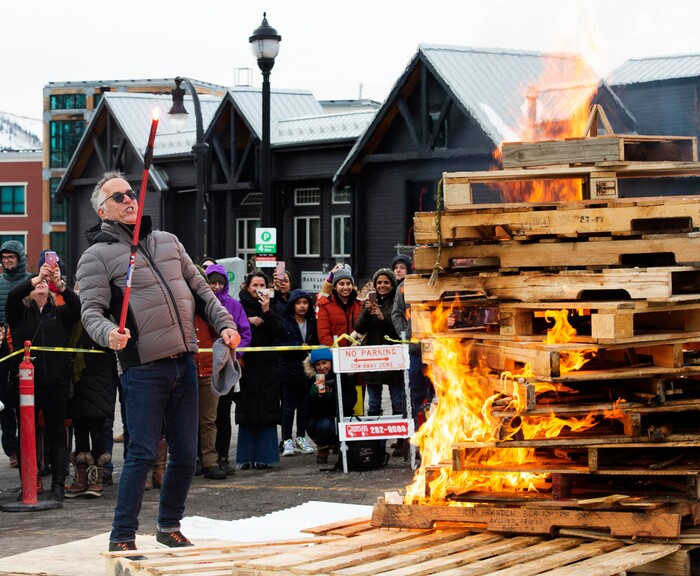 (Rick Egan  |  The Salt Lake Tribune)      John Cooper, the festival's director, lights the first-ever Sundance bonfire, a community gathering on Swede Alley, in Park City, Thursday, Jan. 30, 2020.