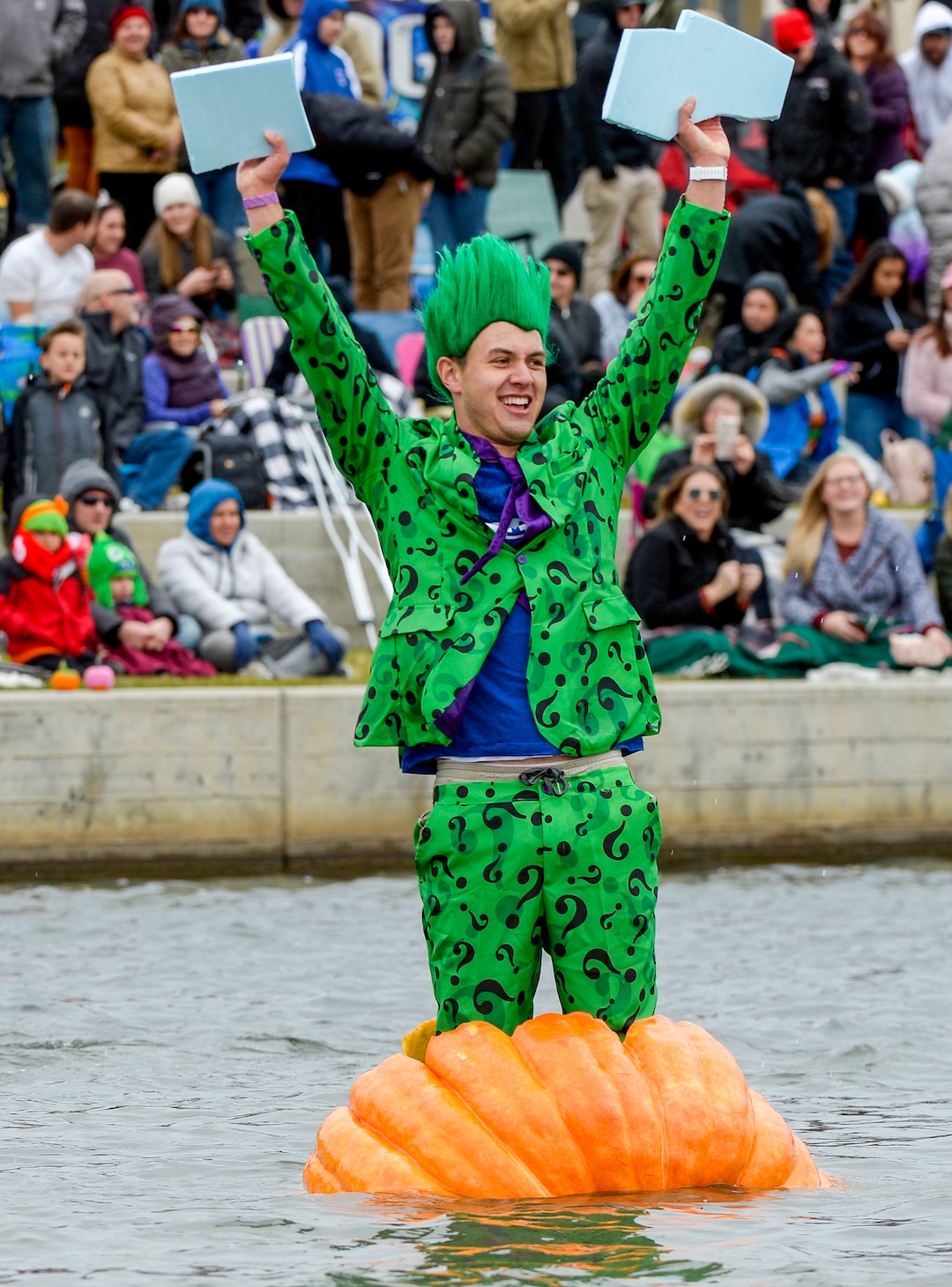 (Leah Hogsten  |  The Salt Lake Tribune) Pumpkin regatta competitor Luke Zander celebrates his first place finish during the annual Giant Pumpkin Regatta trophy race, October 19, 2019 on Oquirrh Lake in Daybreak, South Jordan.