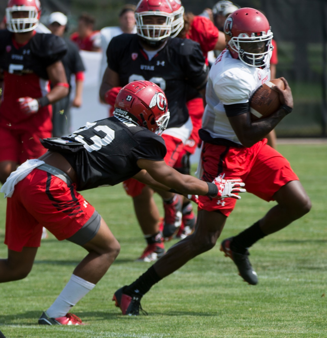 (Rick Egan  |  The Salt Lake Tribune)Utah quarterback Tyler Huntley runs the ball during practice, Monday, August 7, 2017.