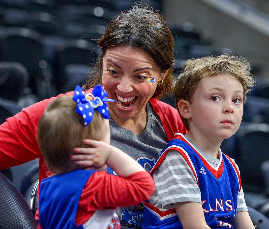 Leah Hogsten  |  The Salt Lake Tribune  March madness has begun for Elaine Minahan, her daughter Maren, 2, and son Johnny, 5, of Park City. Minahan is a Kansas alumni and a Perry, Kansas native. The Kansas Jayhawks take the court during the 2019 NCAA Division I Men's Basketball Championship, March 20, 2019 in preparation for their first round game against the Northeastern Huskies on Thursday.
