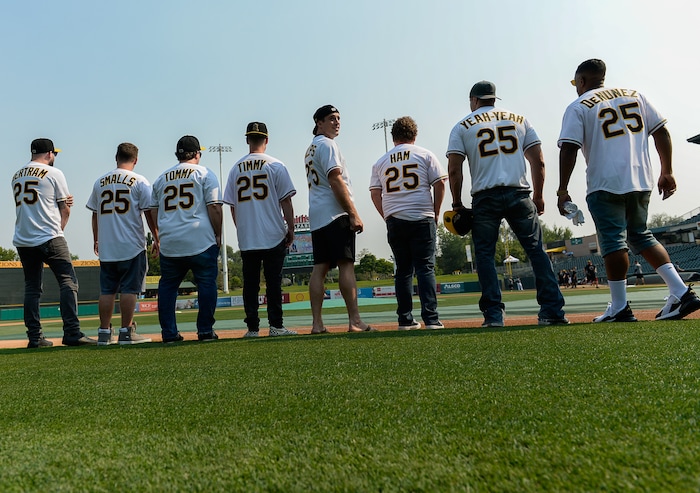 (Francisco Kjolseth  |  The Salt Lake Tribune)  The Salt Lake Bees celebrate the 25th anniversary of the Utah-filmed "The Sandlot" with members of the original cast at the Smith's Ballpark on Friday, Aug. 10, 2018. Bertram (Grant Gelt), Smalls (Tom Guiry), Tommy (Shane Obedzinski) Timmy (Victor DiMattia), Phillips (Wil Horneff) Ham (Patrick Renna), Yeah-Yeah (Marty York) and DeNunez (Brandon Quintin Adam), from left, gather on the field with their personalized Bee's jerseys before the start of the night's game. 