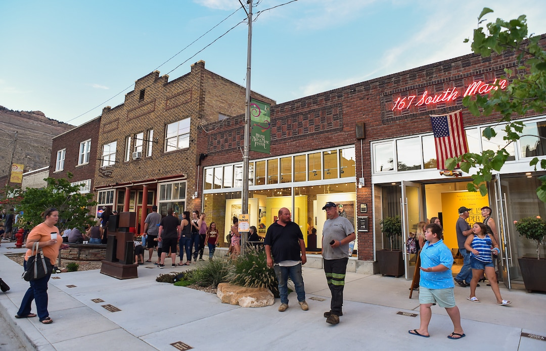 (Francisco Kjolseth  |  The Salt Lake Tribune)  Helper First Fridays draws people to historic Main Street on Friday, Aug. 2, 2019, for their monthly gallery stroll where the small town has been discovered by a variety of artists and dreamers seeking to escape the hustle of the Wasatch Front, lured by cheap real estate prices. Helper today resembles Park City in the late 1960s. Some aging, empty buildings remain, but newcomers joining natives are slowly reinventing the little town of just over 2,000 residents as an artist colony and tourist destination.