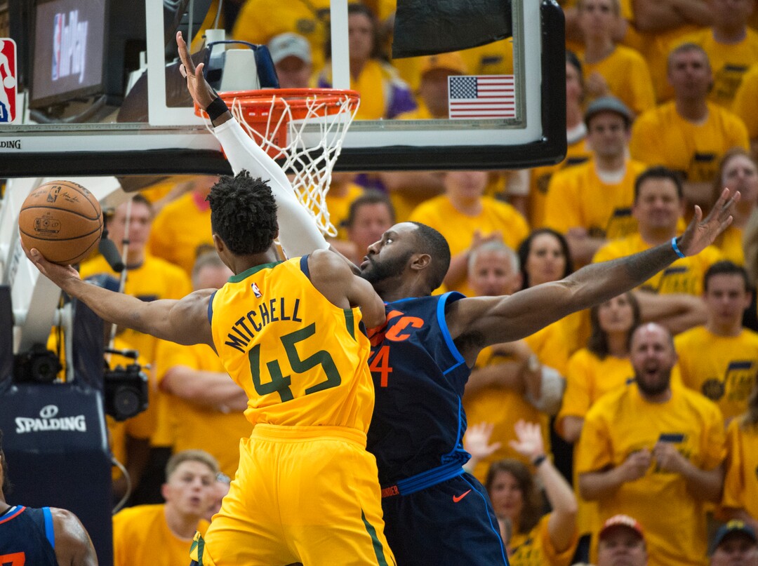 (Rick Egan  |  The Salt Lake Tribune)     Utah Jazz guard Donovan Mitchell (45) scores over Oklahoma City Thunder forward Patrick Patterson (54) at the end of the second quarter, in playoff action in game 6, between Utah Jazz and Oklahoma City Thunder in Salt Lake City, Friday, April 27, 2018.