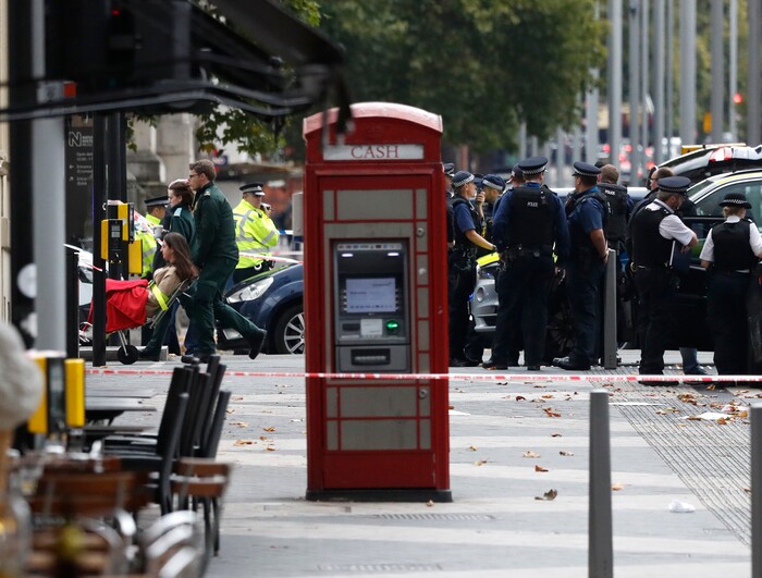 Ambulance personel push a woman on a stretcher at the scene of an incident in central London, Saturday, Oct. 7, 2017. London police say emergency services are outside the Natural History Museum in London after a car struck pedestrians. (AP Photo/Kirsty Wigglesworth)