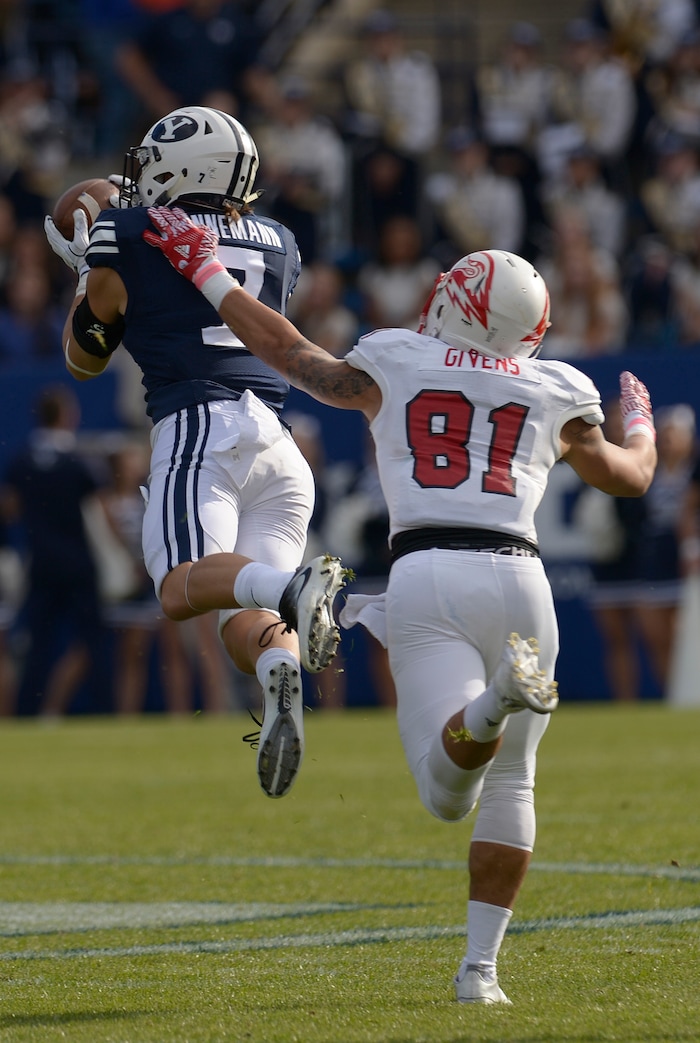 Leah Hogsten  |  The Salt Lake TribuneBrigham Young Cougars defensive back Micah Hannemann (7) catches a pass intended for Southern Utah Thunderbirds wide receiver Elijah Givens (81) but fumbles as he's tackled. Brigham Young University leads Southern Utah University 31-76 during their first match up at LaVell Edwards Stadium,  Saturday, November 12, 2016.