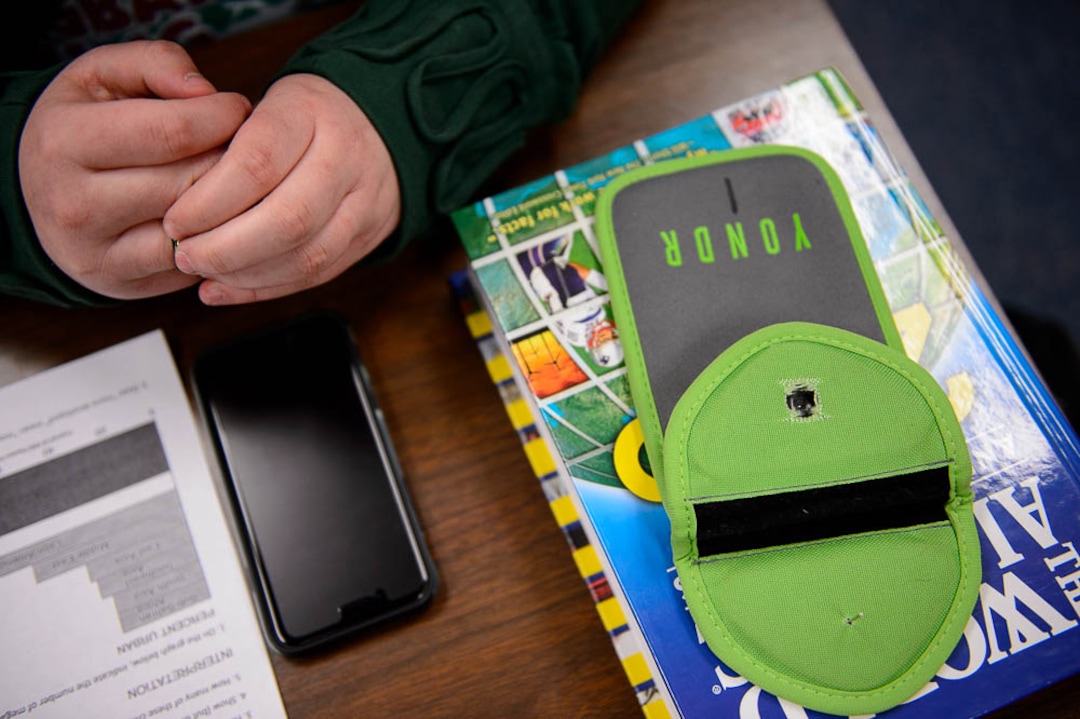 (Trent Nelson | The Salt Lake Tribune) Students in Monta Thomas' classes at Brighton High School in Cottonwood Heights secure their phones in locking pouches made by Yondr.
