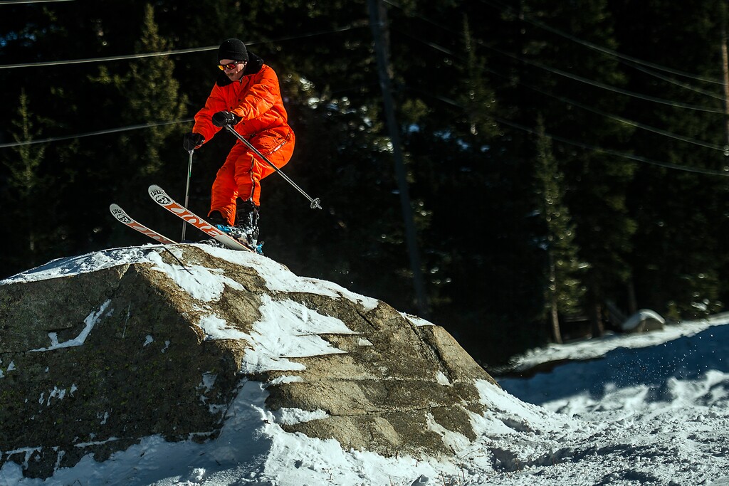 ( Chris Detrick  |  Tribune file photo ) This skier flew off a big boulder near Majestic lift on the opening day of the 2014 season at Brighton, which will be Utah's first to open again this winter. The Majestic and Explorer lifts will offer limited terrain to skiers and riders at a reduced price.