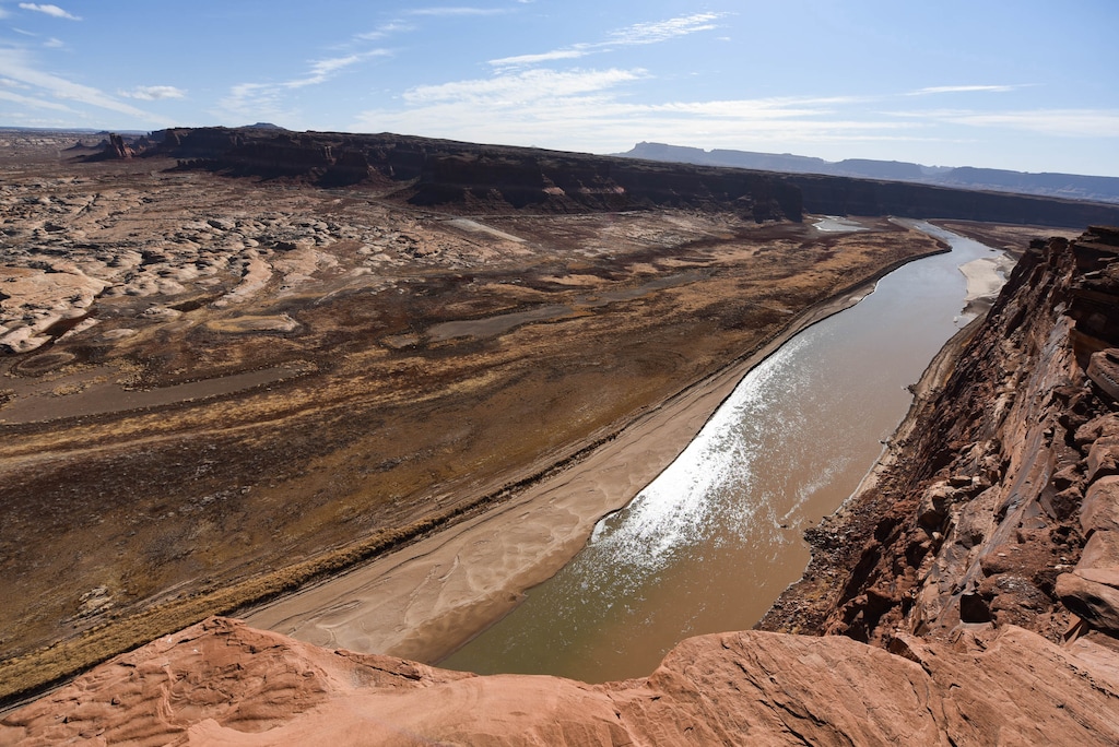 (Francisco Kjolseth  | The Salt Lake Tribune) The Hite Marina boat ramp, center, sits idle hundreds of yards from the river’s edge where the Colorado River flows into Lake Powell on Thursday, Feb. 4, 2021.