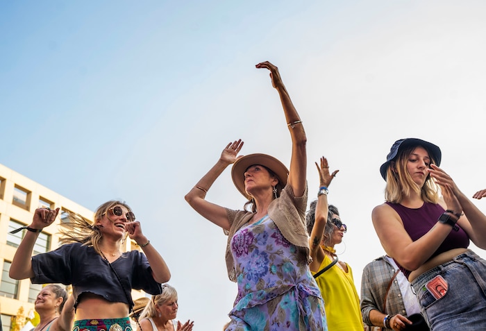 (Rick Egan | The Salt Lake Tribune) Arts festival revelers dance to the sounds of Super Bubble, at the Salt Lake Arts Festival, on Saturday, Aug. 28, 2021.