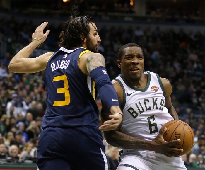 Milwaukee Bucks' Eric Bledsoe (6) drives to the basket against Utah Jazz's Ricky Rubio during the first half of an NBA basketball game Saturday, Dec. 9, 2017, in Milwaukee. (AP Photo/Aaron Gash)