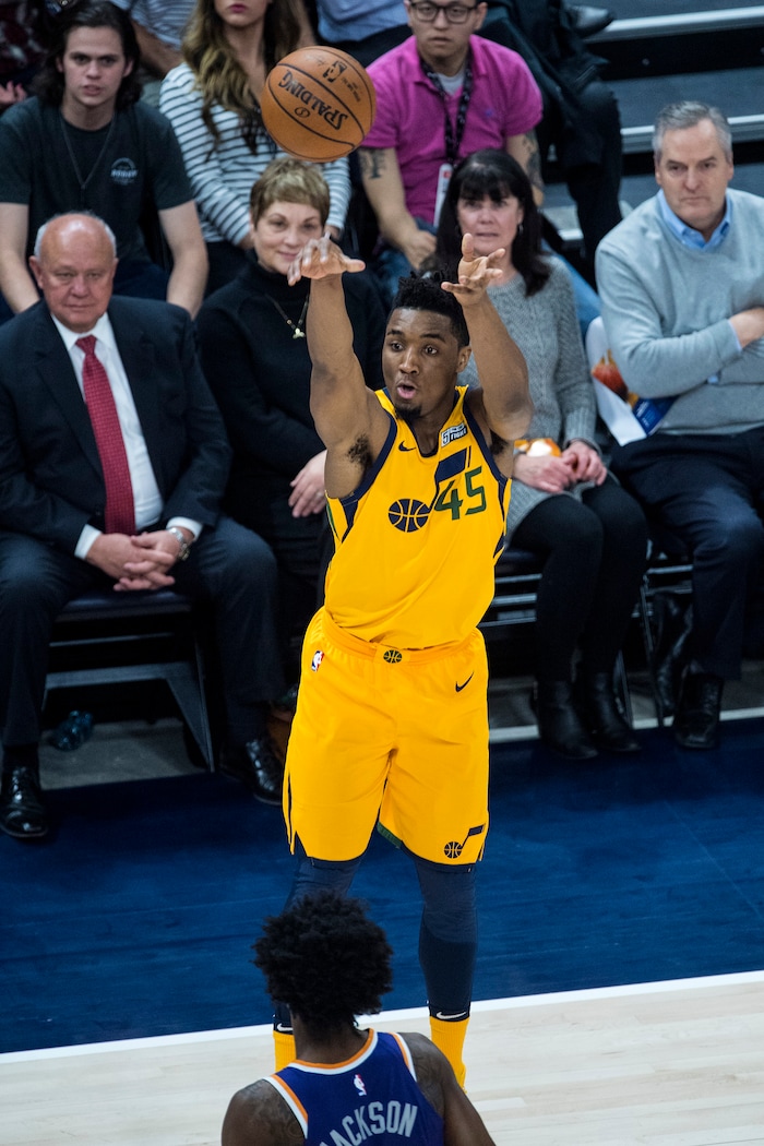 (Chris Detrick  |  The Salt Lake Tribune)  Utah Jazz guard Donovan Mitchell (45) shoots a three-pointer during the game at Vivint Smart Home Arena Thursday, March 15, 2018. 