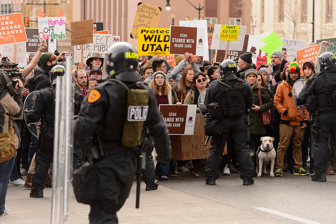 (Trent Nelson | The Salt Lake Tribune)  Police and protesters downtown after a rally against a visit by President Donald Trump, Monday December 4, 2017.