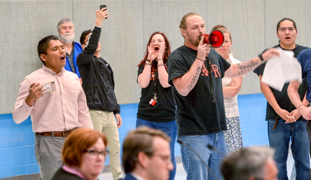 Leah Hogsten  |  The Salt Lake Tribune   A group called Civil Riot shut down the Inland Port Authority Board meeting at North Star ElementaryÕs gymnasium Wednesday, April 24, 2019 shortly after it began by speaking over board chairman Derek Miller. 
