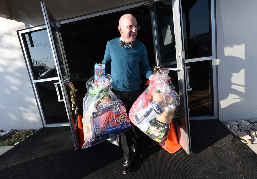 (Francisco Kjolseth  |  The Salt Lake Tribune)  Brent Severe, CEO of the Granite Education Foundation helps with orders as part of the Santa Sacks program that helps bring some holiday magic to those in need. Started in 2009 the program was expecting to fill over 3000 sacks with blankets, books, socks, hats, toothbrushes, school supplies and toys.