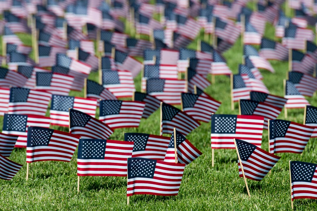 (Rick Egan  |  The Salt Lake Tribune)   3000 flags wave in the grass in front of Skyline High School in memory of those who lost their lives 17 years ago.  Tuesday, Sept. 11, 2018.