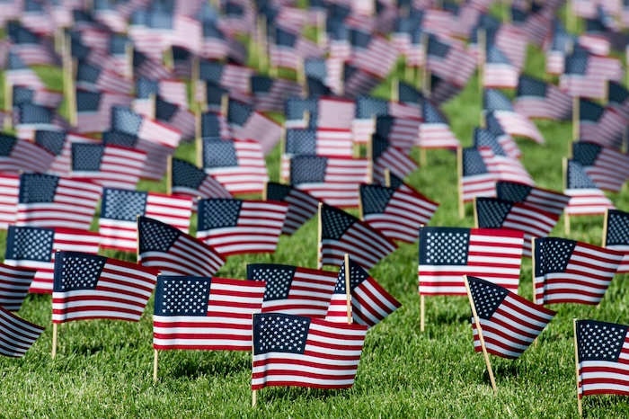 (Rick Egan | The Salt Lake Tribune) 3000 flags wave in the grass in front of Skyline High School in memory of those who lost their lives 17 years ago. Tuesday, Sept. 11, 2018.