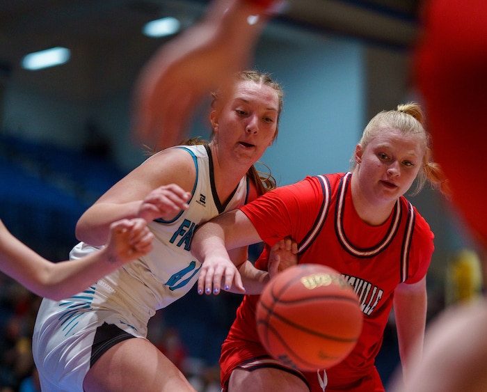 (Trent Nelson  |  The Salt Lake Tribune) Farmington's Delaney Baker and Springville's Addisyn Johnson as Springville faces Farmington High School in the 5A girls basketball state championship game, in Taylorsville on Saturday, March 6, 2021.