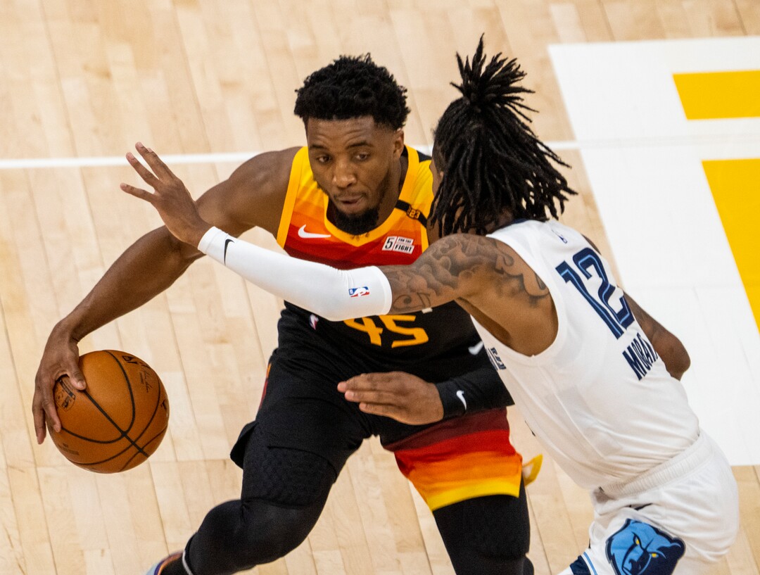 (Rick Egan | The Salt Lake Tribune)Utah Jazz guard Donovan Mitchell (45) is guarded by Memphis Grizzlies guard Ja Morant (12), in NBA Playoff game 2, between the Utah Jazz and the Memphis Grizzlies at Vivint Arena, on Wednesday, May 26, 2021.