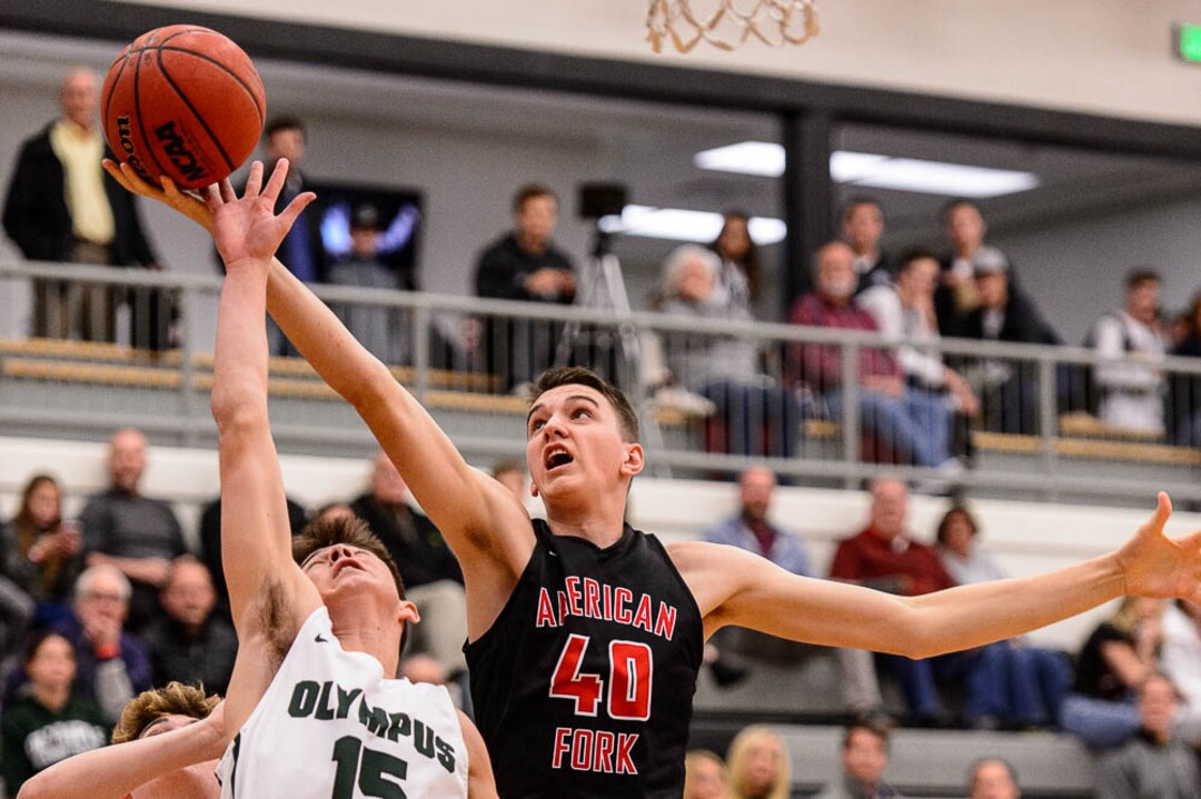 (Trent Nelson | The Salt Lake Tribune)  Olympus's Rylan Jones and American Fork's Isaac Johnson as American Fork hosts Olympus in the Utah Elite Eight tournament, Saturday December 9, 2017.