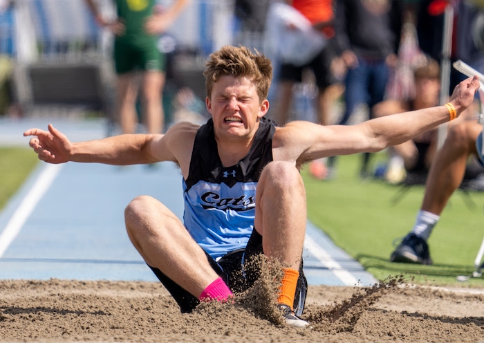 (Rick Egan | The Salt Lake Tribune) Will Warner, Snow Canyon, wins the 4A Boys long jump, at the Utah State High School Track Championship in Provo, on Friday, May 20, 2022.
