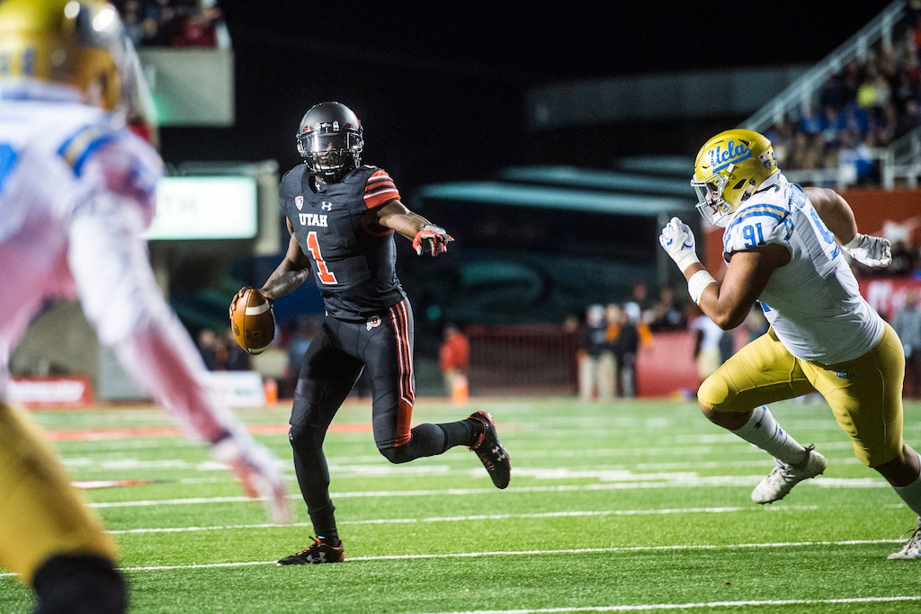 (Chris Detrick | The Salt Lake Tribune) Utah Utes quarterback Tyler Huntley (1) looks to throw a touchdown pass to Utah Utes fullback Cody Ippolito during the game at Rice-Eccles Stadium Friday, November 3, 2017. Utah Utes defeated UCLA Bruins 48-17.
