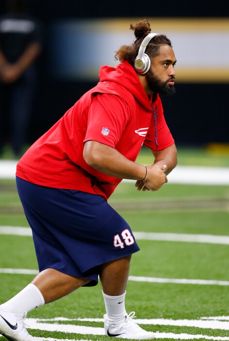 New England Patriots linebacker Harvey Langi warms up before an NFL football game against the New Orleans Saints in New Orleans, Sunday, Sept. 17, 2017. (AP Photo/Butch Dill)