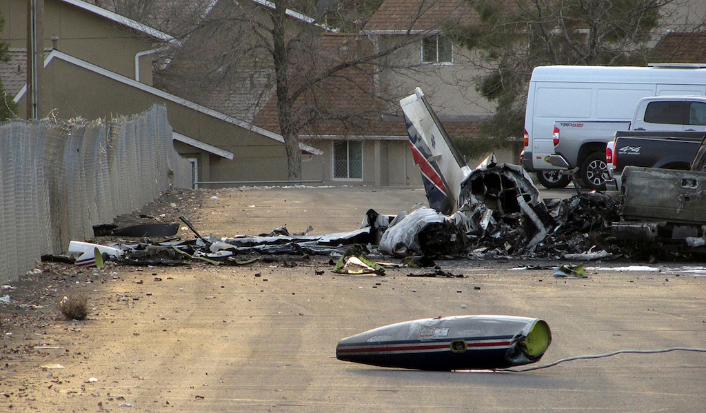 (Jeffry Mullins | The Daily Free Press | The Associated Press) The wreckage of an American Medflight plane sits in the Barrick Gold Corp. parking lot in Elko, Nev., Saturday, Nov. 19, 2016. The Federal Aviation Administration and the National Transportation safety board will investigate the fiery crash in northern Nevada in which all four people aboard the air-ambulance flight were reported killed.