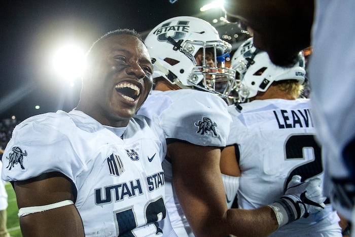 (Chris Detrick  |  The Salt Lake Tribune)  Utah State Aggies cornerback Jalen Davis (13) celebrates after the game at Merlin Olsen Field at Maverik Stadium Friday, September 29, 2017. Utah State Aggies defeated Brigham Young Cougars 40-24.