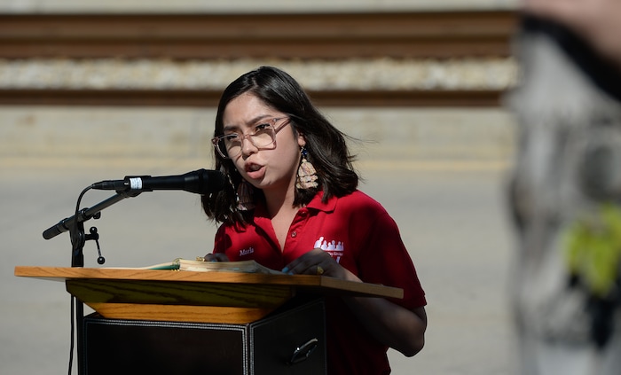 (Francisco Kjolseth  |  The Salt Lake Tribune)  Maria Montes, Community Engagement and Advocacy Coordinator for Communidades Unidas brings attention to the children who have died in detention centers at the border as she joins the voices gathered outside of the U.S. Immigration and Customs Enforcement (ICE) field office at 2975 S. Decker Lake Drive, West Valley City, on Saturday, Aug. 10, 2019, for a Close The Camps vigil.