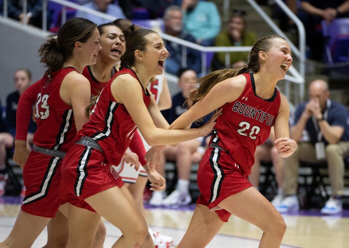 (Rick Egan | The Salt Lake Tribune) The Bountiful Redhawks celebrate their win over the Springville Red Devils, for the Girls 5A State Championship at Weber State, on Saturday, March 4, 2023.

