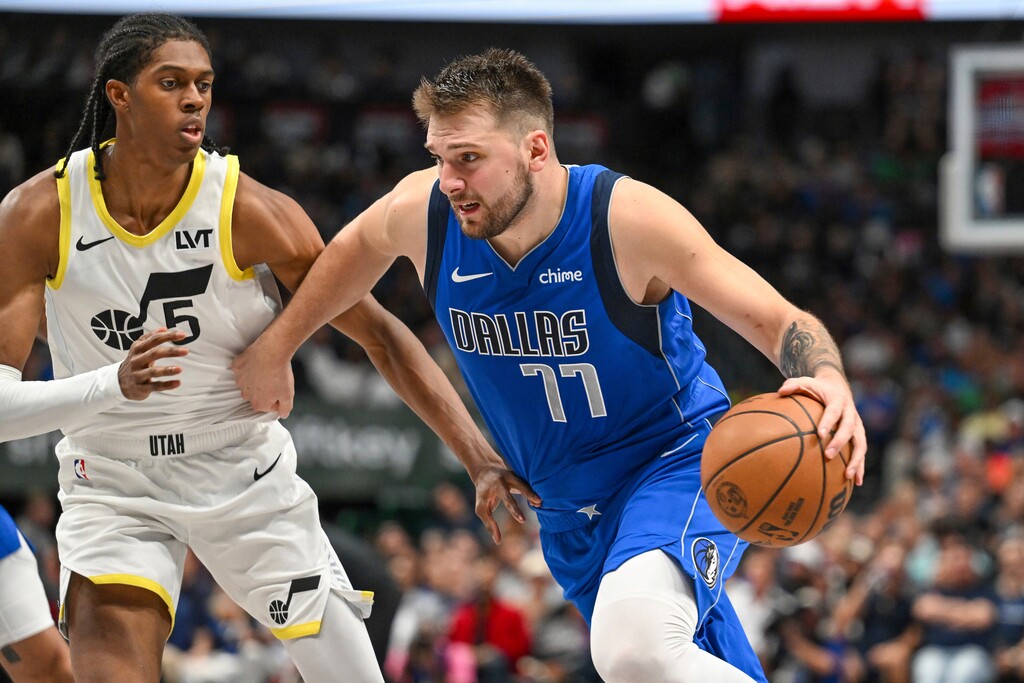 Dallas Mavericks guard Luka Doncic (77) drives against Utah Jazz forward Cody Williams (5) in the second half of an NBA basketball game, Monday, Oct. 28, 2024, in Dallas. (AP Photo/Albert Pena)