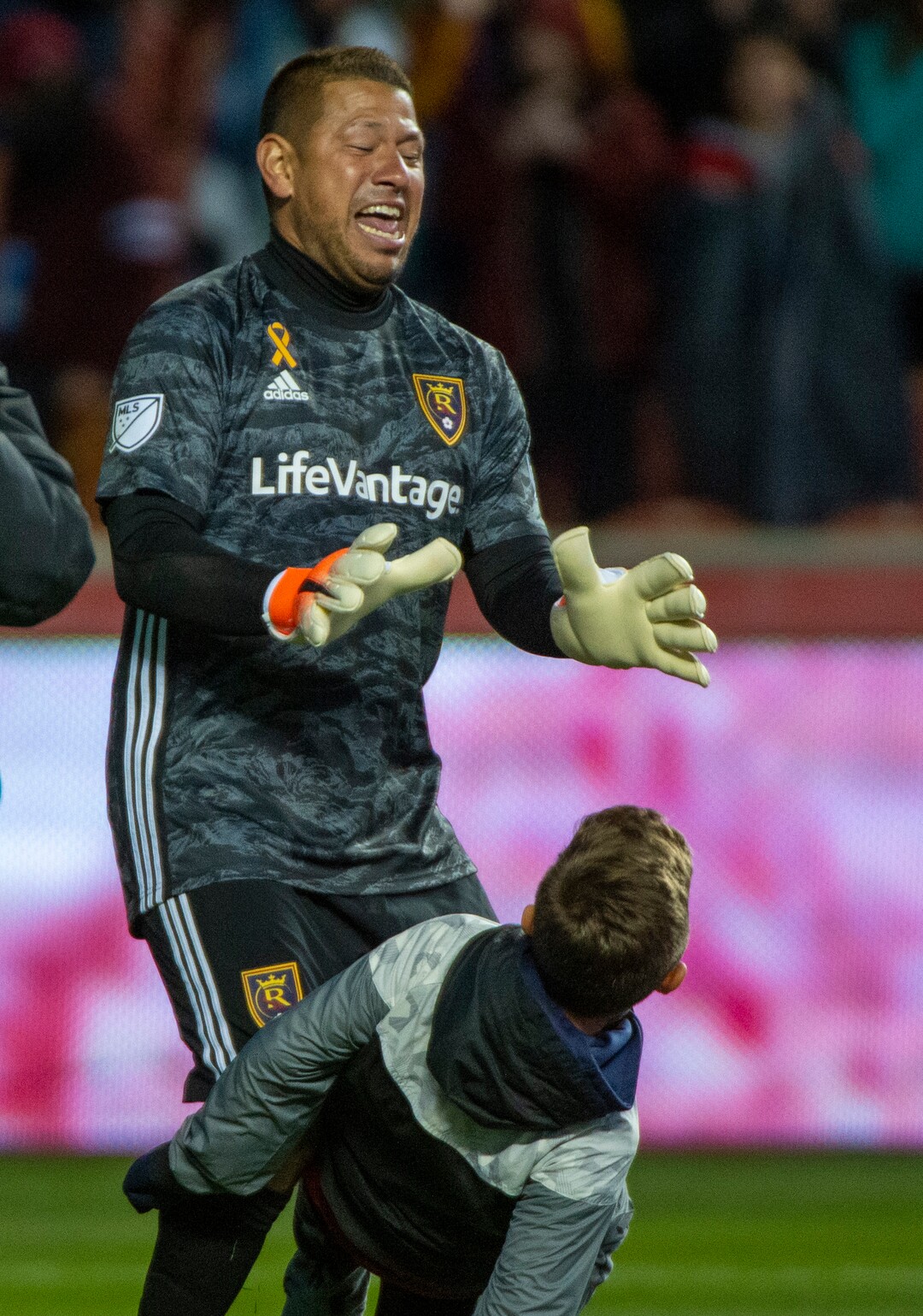 (Rick Egan  |  The Salt Lake Tribune)      Jett Rimando rushes out to congratulate his dad, as Real Salt Lake goalkeeper Nick Rimando (18) as Real Salt Lake defeats the Houston Dynamo 2-1 in his last regular season home game, in MLS soccer action, at Rio Tinto Stadium, Sunday, Sept. 29, 2019.