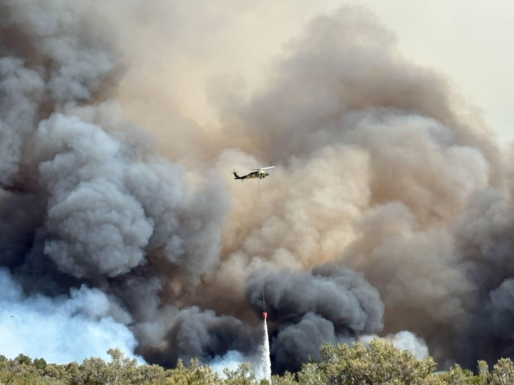 (U.S. Forest Service) A helicopter drops water on the Monroe Canyon Fire near Richfield, Sunday, Aug. 3, 2025.