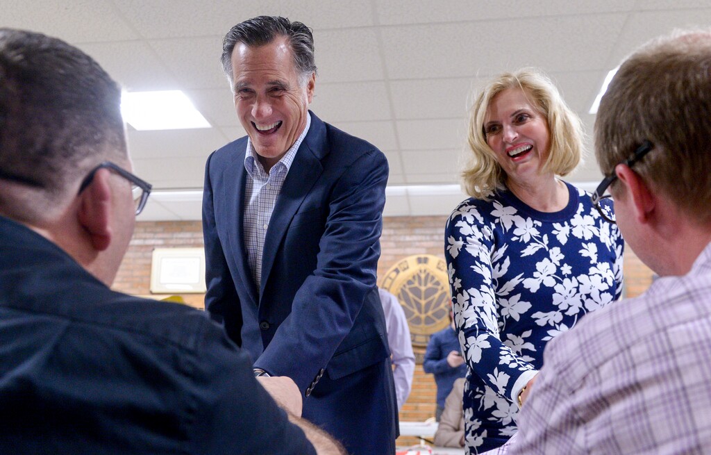 (Leah Hogsten  |  The Salt Lake Tribune) Mitt and Ann Romney share a laugh with caucus workers. The Romneys attended their local caucus meeting with other members of the Holladay Precinct 23. A combined 35 caucuses held opening ceremonies together at Cottonwood High School Tuesday, March 20, 2018.  