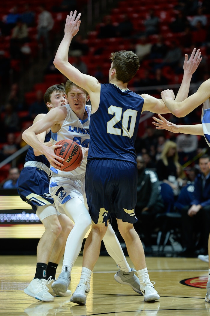 (Francisco Kjolseth  |  The Salt Lake Tribune)  Westlake vs Layton, 6A State high school basketball tournament at the Huntsman Center in Salt Lake City, Thursday March 1, 2018. Chase Potter (24) tries to push past Cooper Mattson (20). 