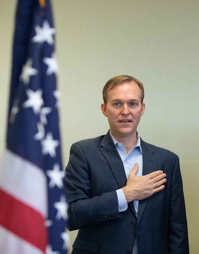 (Keith Johnson  |  for The Salt Lake Tribune) Newly elected Utah Congressman Ben McAdams, representing Utah's 4th District, participates in the Pledge of Allegiance before the start of a town hall meeting at the Redwood Recreational Center in West Valley City, Utah on Jan. 19, 2019. McAdams held the town hall meeting to make good on a promise to be more accessible to constituents, a criticism he leveled against former congresswoman Mia Love during McAdam's campaign. 