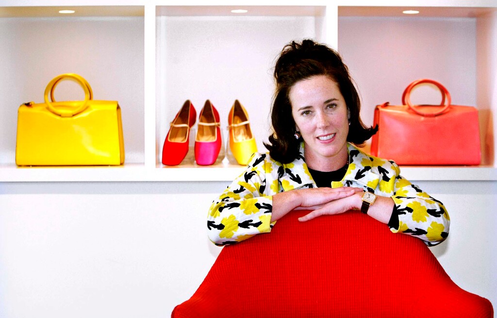 (Bebeto Matthews | The Associated Press) In this May 13, 2004 file photo, designer Kate Spade poses with handbags and shoes from her next collection in New York. Law enforcement officials say Tuesday, June 5, 2018, that New York fashion designer Kate Spade has been found dead in her apartment in an apparent suicide.