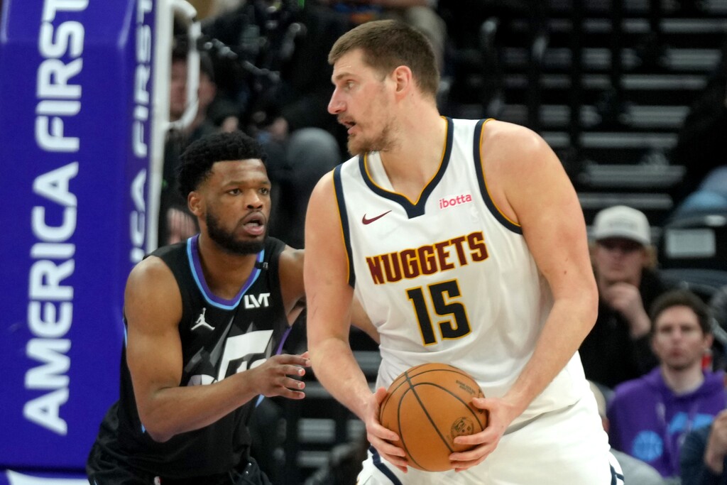 (Rick Egan | The Salt Lake Tribune) Utah Jazz guard Elijah Harkless (16) guards Denver Nuggets center Nikola Jokic (15) on Monday night.